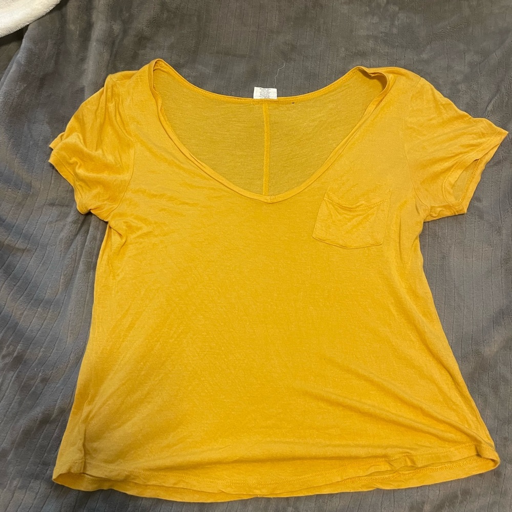 yellow t shirt. v neck